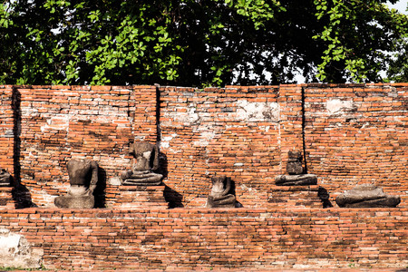 broken Buddha statues in ancient cityの写真素材