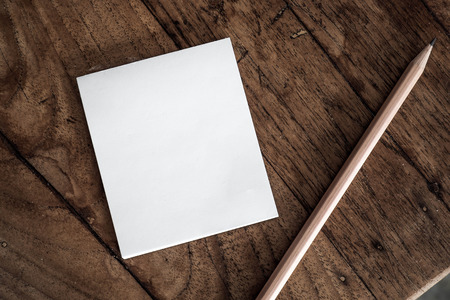 notepad and pencil on wooden tableの写真素材