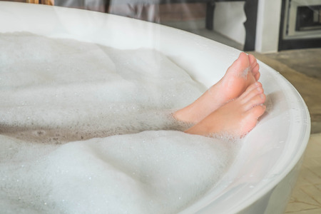 girl feet in bath tubの写真素材