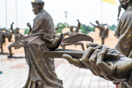 Sculpture of bat on handの写真素材