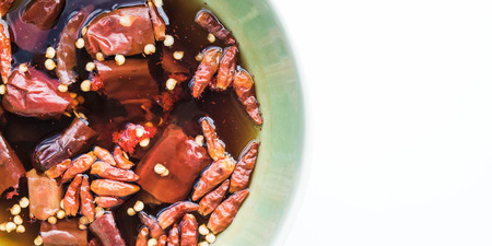 Dry chili soak, prepared for spices on white backgroundの写真素材