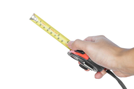Hand holding nylon measurement tapeの写真素材