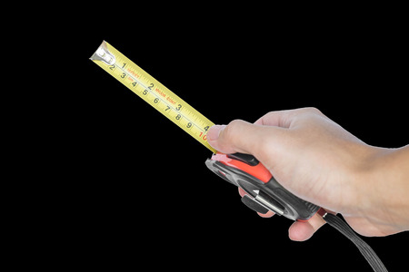 Hand holding nylon measurement tapeの写真素材