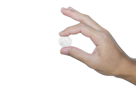 Hand holding silver coinの写真素材