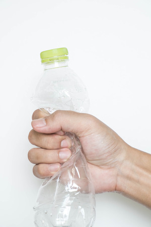 Male hand squeeze plastic bottleの写真素材