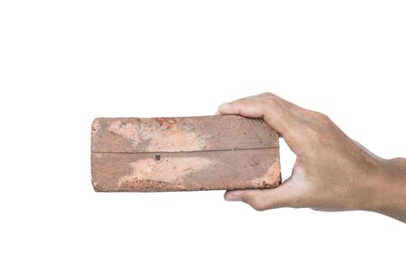 Hand holding old decay low quality brick, isolated on white backgroundの写真素材