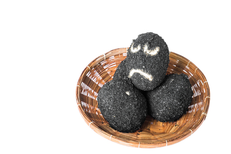 Salted eggs in rattan basket with sad faceの写真素材