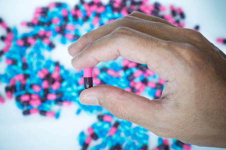 Hand holding pill capsuleの写真素材