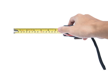 Hand holding nylon measurement tape, selective focusの写真素材