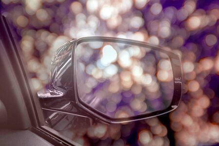 Vintage tone,soft focus, abstract car's wing mirror with blurred bokeh speed motion background and o Vintage tone,soft focus, abstract car's wing mirror with blurred bokeh speed motion background and on rear view in the mirrorの写真素材