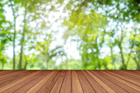 Wooden lath with blurred natural green Bokeh backgroundの写真素材