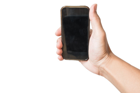 Hand holding old smartphone in selfie position, isolated on white backgroundの写真素材