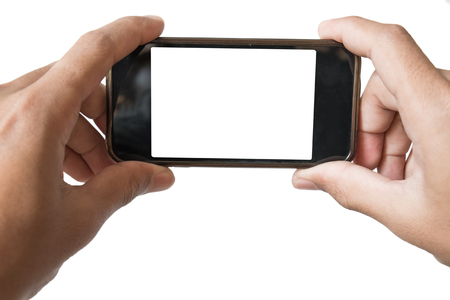 Hands holding smartphone, in playing game or watching movie or taking photo positionの写真素材