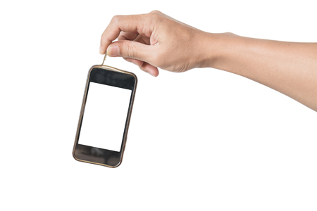 Hand holding old waste smartphone, technology waste, isolated on white backgroundの写真素材