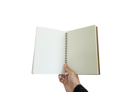 Hand holding opened notebook, isolated on white backgroundの写真素材