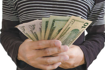 Hand holding cash, selective focus on hand isolated on white backgroundの写真素材