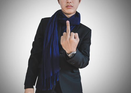 Businessman in casual suit showing middle fingerの写真素材