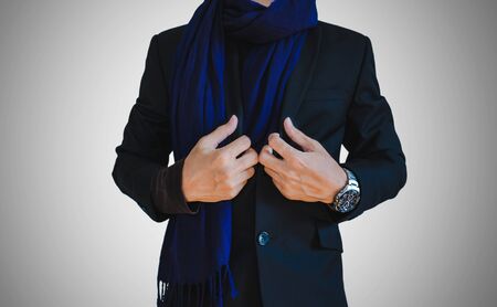 Businessman in winter casual suit with scarfの写真素材