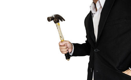 Businessman holding old hammer, isolated on white backgroundの写真素材