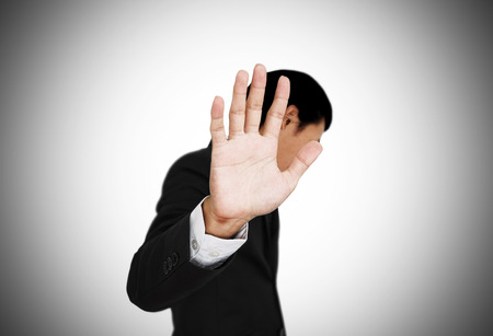 Businessman showing palm hand, concept of denialの写真素材