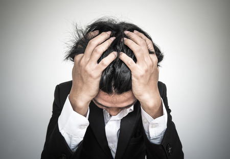 Close-up businessman with burnout syndromeの写真素材