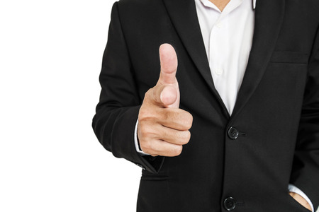 Businessman in black suit pointing hand gun sign to screen, selective focus, isolated on white backgroundの写真素材