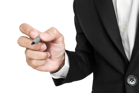 Businessman's hand holding pen in writing position on screen, isolated on white backgroundの写真素材