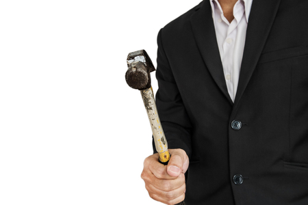 Businessman holding hammer, isolated on white backgroundの写真素材