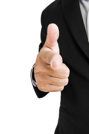 Businessman in black suit pointing hand gun sign to screen, selective focus, isolated on white backgroundの写真素材