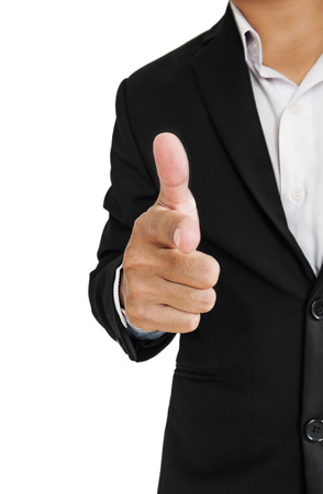 Businessman in black suit pointing hand gun sign to screen, selective focus, isolated on white backgroundの写真素材