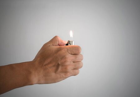 a man hand and with lighterの写真素材