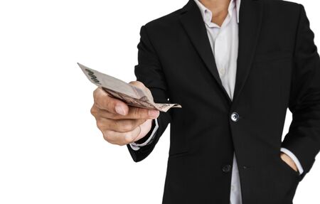 Businessman giving or receiving cash, selective focus, isolated on white backgroundの写真素材