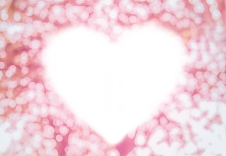 Heart shape bright on blurred Bokeh pink backgroundの写真素材