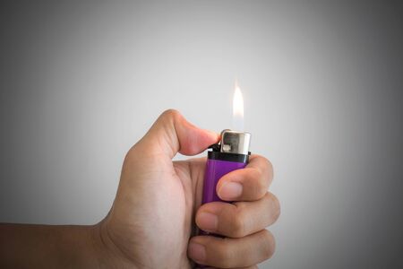 a man hand and with lighterの写真素材
