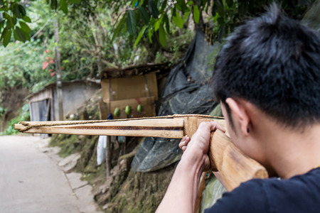 a guy aim crossbow to the target