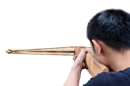 a man aimed crossbow, isolated on white backgroundの写真素材