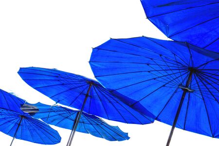 under colorful blue umbrellas, isolated on white backgroundの写真素材