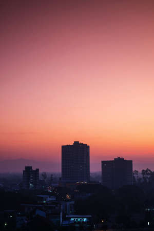 Silhouette, tropical city in dawn with sunrise in Chiang Mai city, Thailandの写真素材