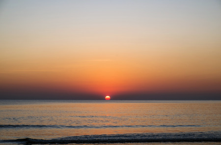 Sunset at the beach in summerの写真素材