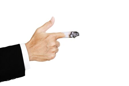 Hand pointing finger with burn out cigarette at finger, concept of harmful of cigaretteの写真素材
