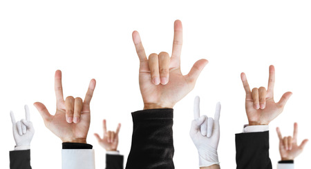 Heavy metal hand sign of difference career raising upward, isolated on white backgroundの写真素材