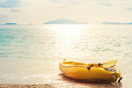 Kayak on tropical beach in sunset, vintage toneの写真素材