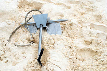 Anchor on white sandの写真素材
