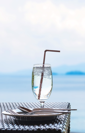 Glass of cold water on dining table on the islandの写真素材