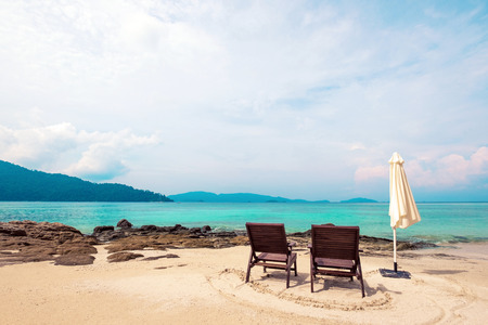 Holidays on the beach, beach chairs on the beach in the morningの写真素材