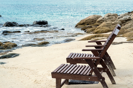 Beach lounge chairs on the beach in the morning. vacation time.beach holiday.beach travel.summer timeの写真素材