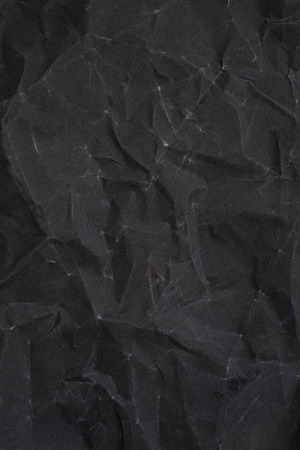 Crumpled black sandpaper texture. crumpled paper. crumpled textureの写真素材