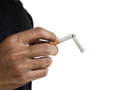 Close up Hand holding break cigarette with copy space, isolated on white backgroundの写真素材