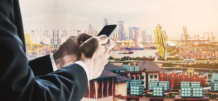 Businessman using smart phone with urban city background