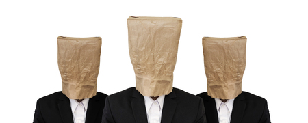 Three guy in suit with brown paper bag on headの写真素材